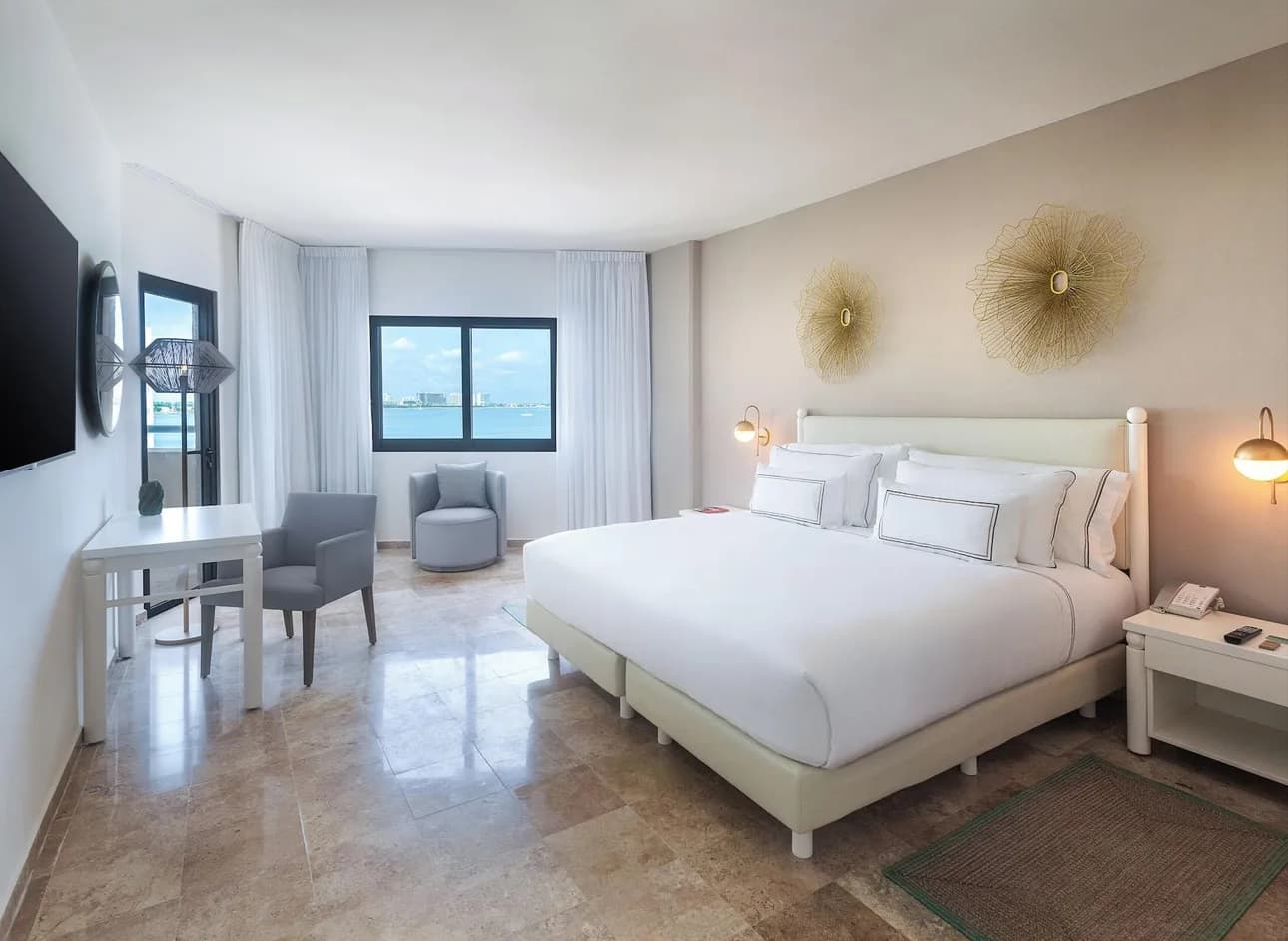 Casa Maya completed guestroom — king bed, lagoon view