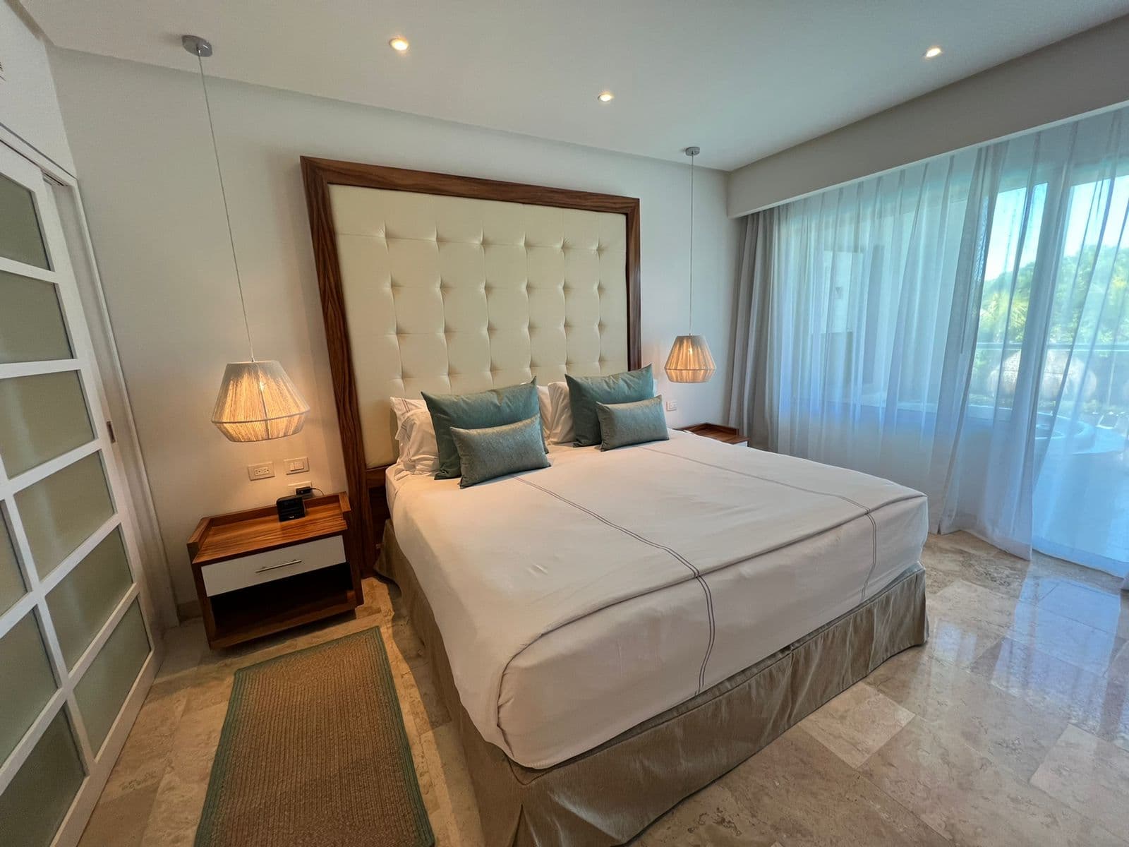 Paradisus completed guestroom — king bed with headboard, Riviera Maya